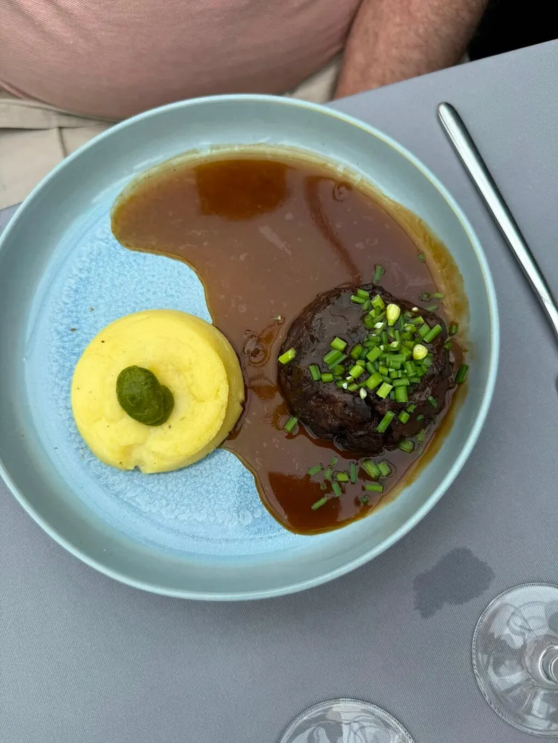 A plated main course served on a Bateaux Parisiens lunch cruise